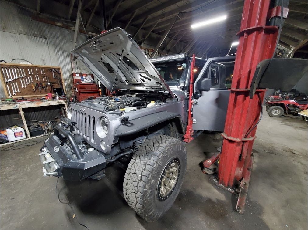 Service bay with a car on the lift